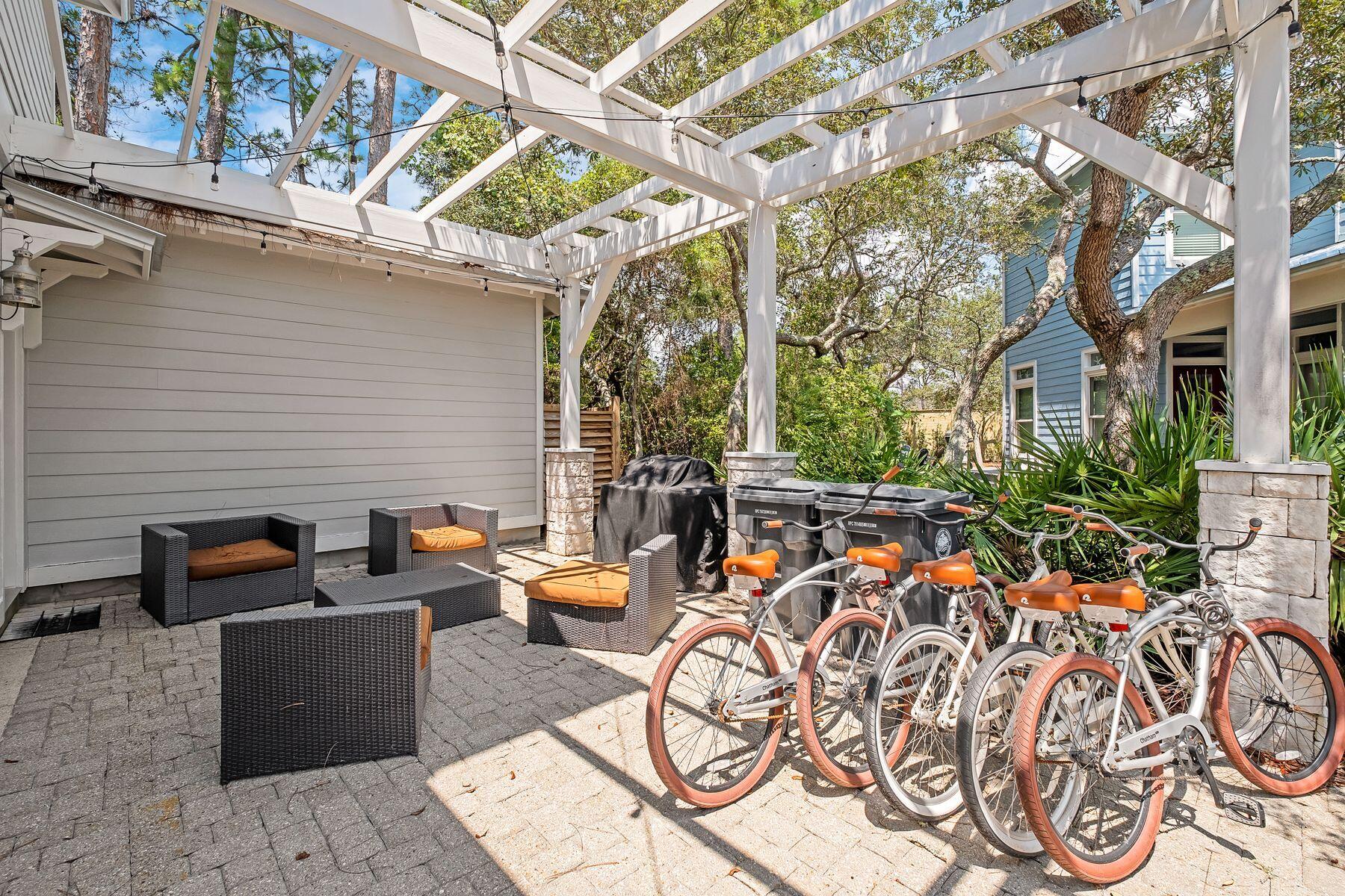 352 Cassine Garden Circle Santa Rosa Beach, FL 32459 - Photo 36 of 43 a view of a patio with table and chairs and potted plants