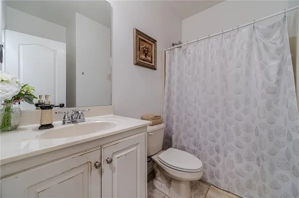 a bedroom with a bed and a mirror