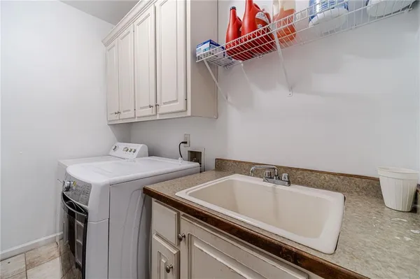 a spacious bathroom with a granite countertop sink mirror and a