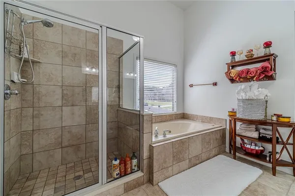 a bedroom with a bed and a rug