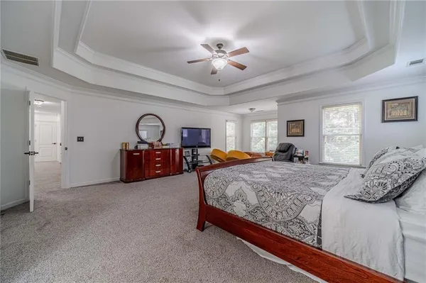 a view of a house with a yard and sitting area