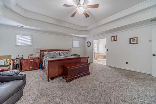 a view of a house with a yard and garage
