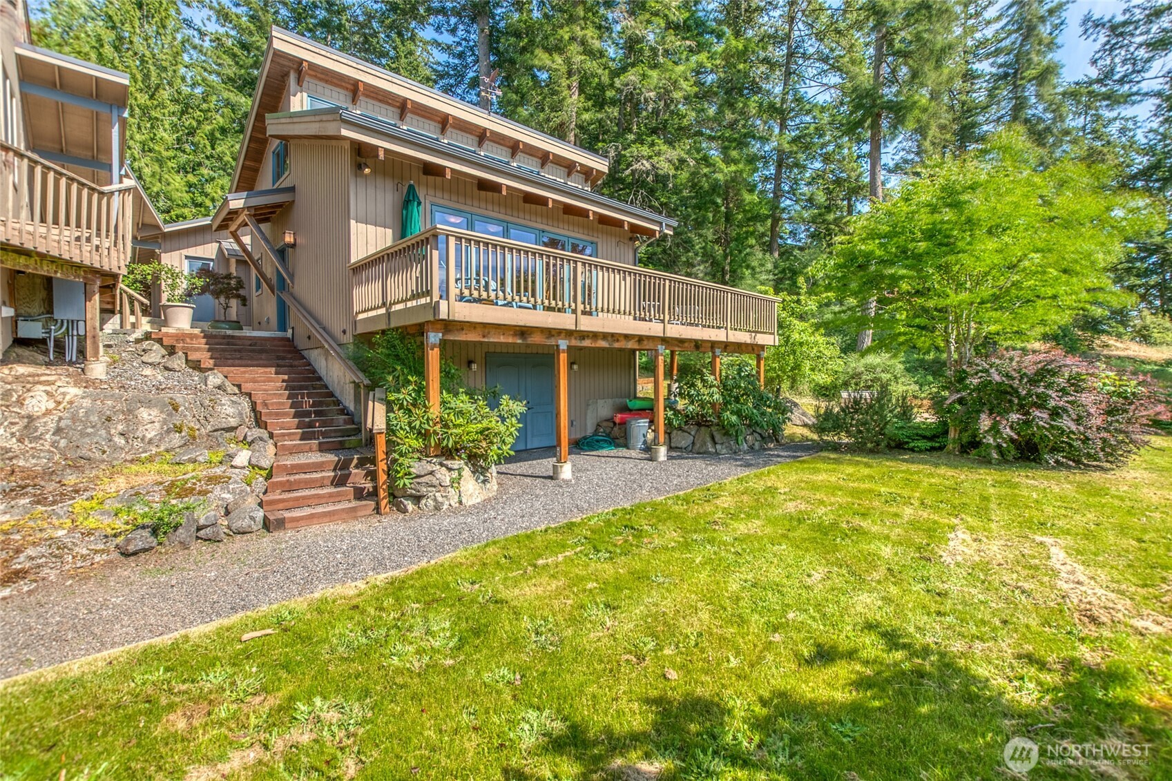 402 Cayou Valley Road Orcas Island, WA 98245 - Photo 5 of 40 a view of a house with a yard patio and swimming pool