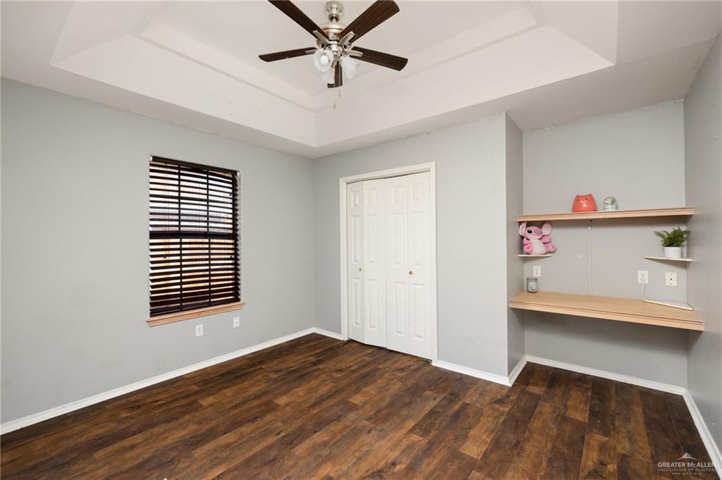 2210 Morning Lane Mission, TX 78572 - Photo 11 of 20 a view of empty room with wooden floor and fan
