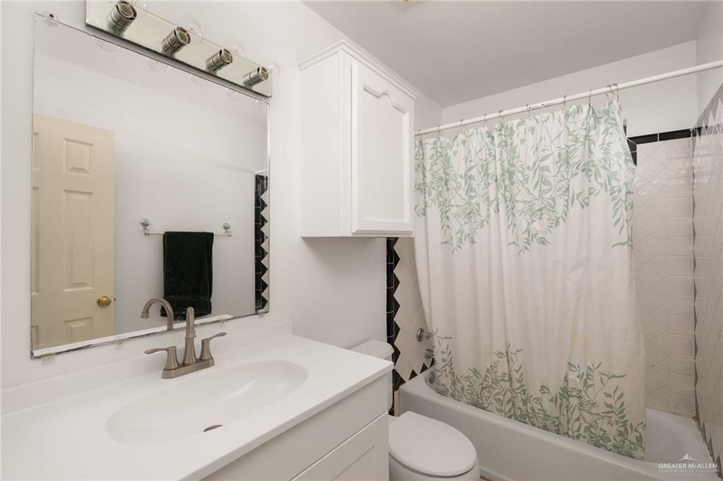 2210 Morning Lane Mission, TX 78572 - Photo 12 of 20 a bathroom with a sink toilet and shower