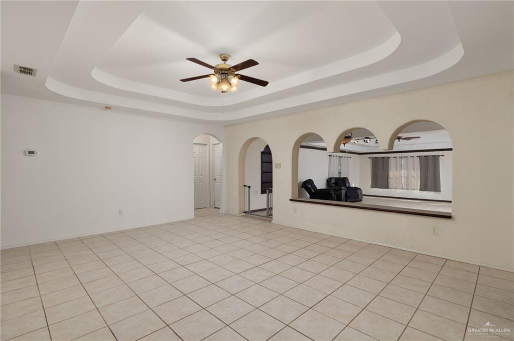 2210 Morning Lane Mission, TX 78572 - Photo 3 of 20 a living room with stainless steel appliances furniture a ceiling fan and window