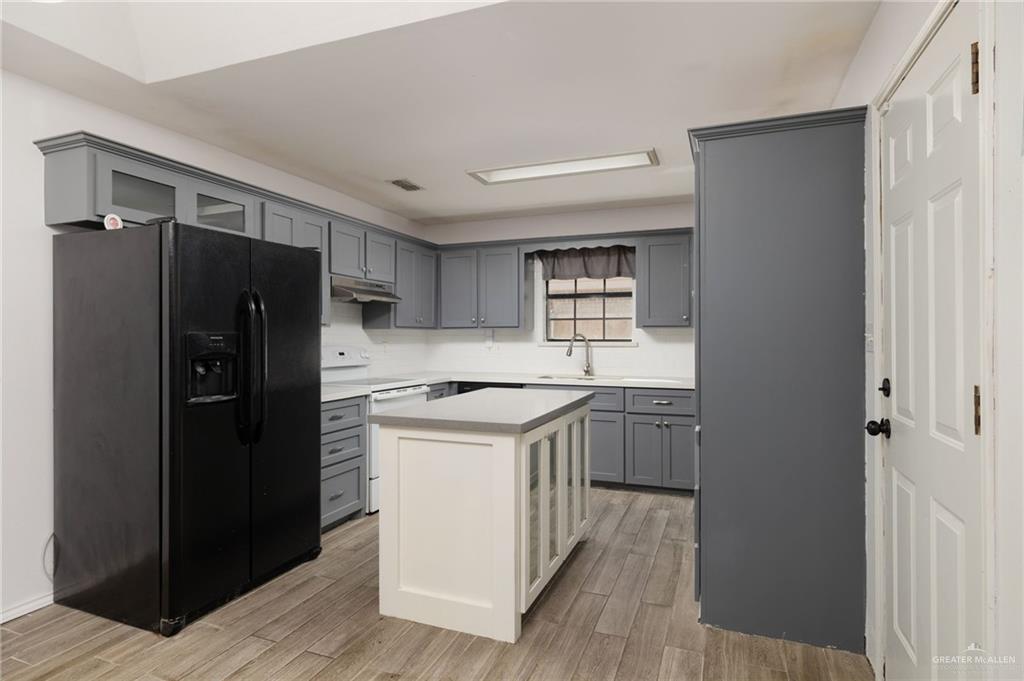2210 Morning Lane Mission, TX 78572 - Photo 6 of 20 a kitchen with a refrigerator sink and stove
