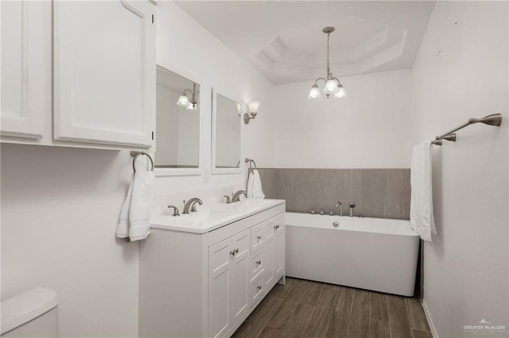 2210 Morning Lane Mission, TX 78572 - Photo 9 of 20 a bathroom with a sink a mirror and a shower