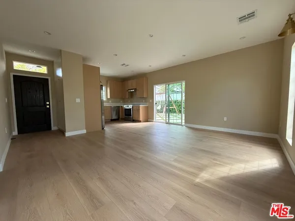 a view of empty room with a fireplace