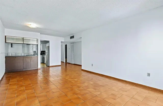 a view of an empty room with a stove