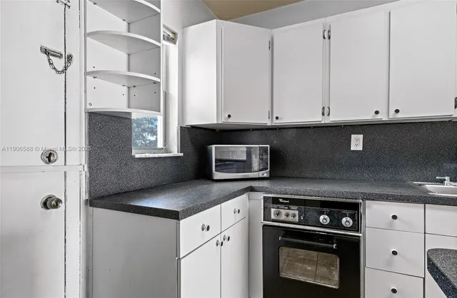 a bathroom with a sink and shower