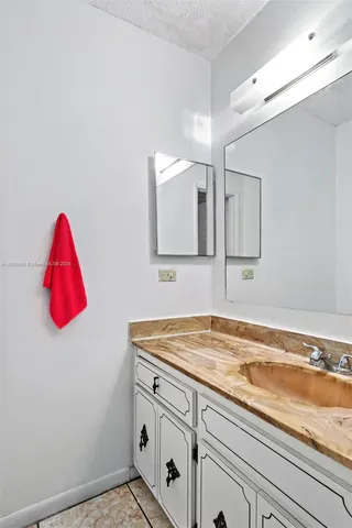 an aerial view of a residential apartment building with a yard