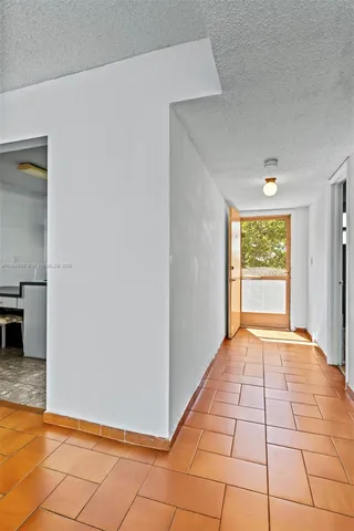 a view of a chairs and table in a patio