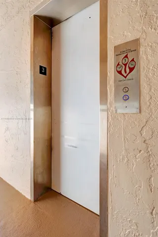 a view of a patio with table and chairs