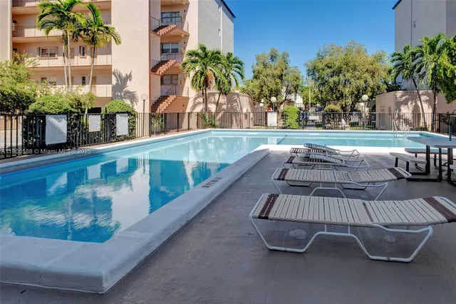 a view of a chairs and table in a patio