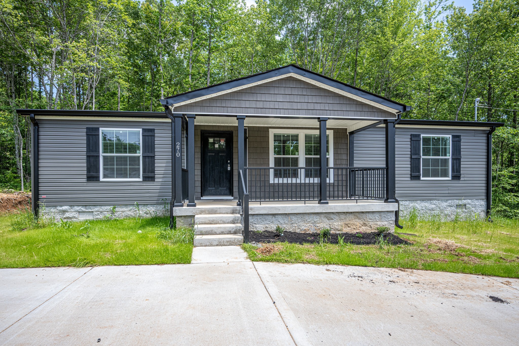 270 East Little Richland Road Waverly, TN 37185 - Photo 1 of 35 a front view of a house with a yard