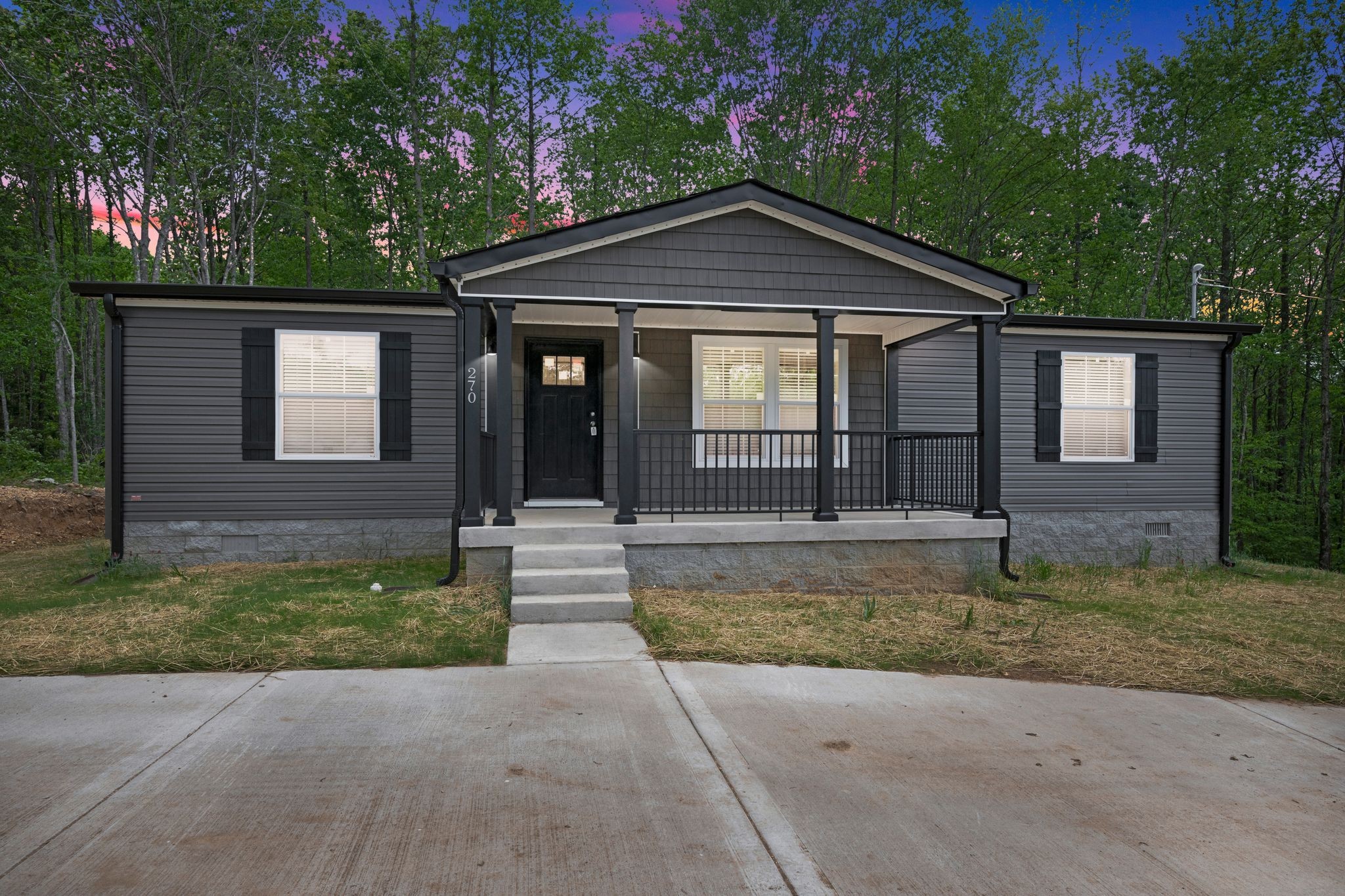 270 East Little Richland Road Waverly, TN 37185 - Photo 2 of 35 a front view of a house with a yard
