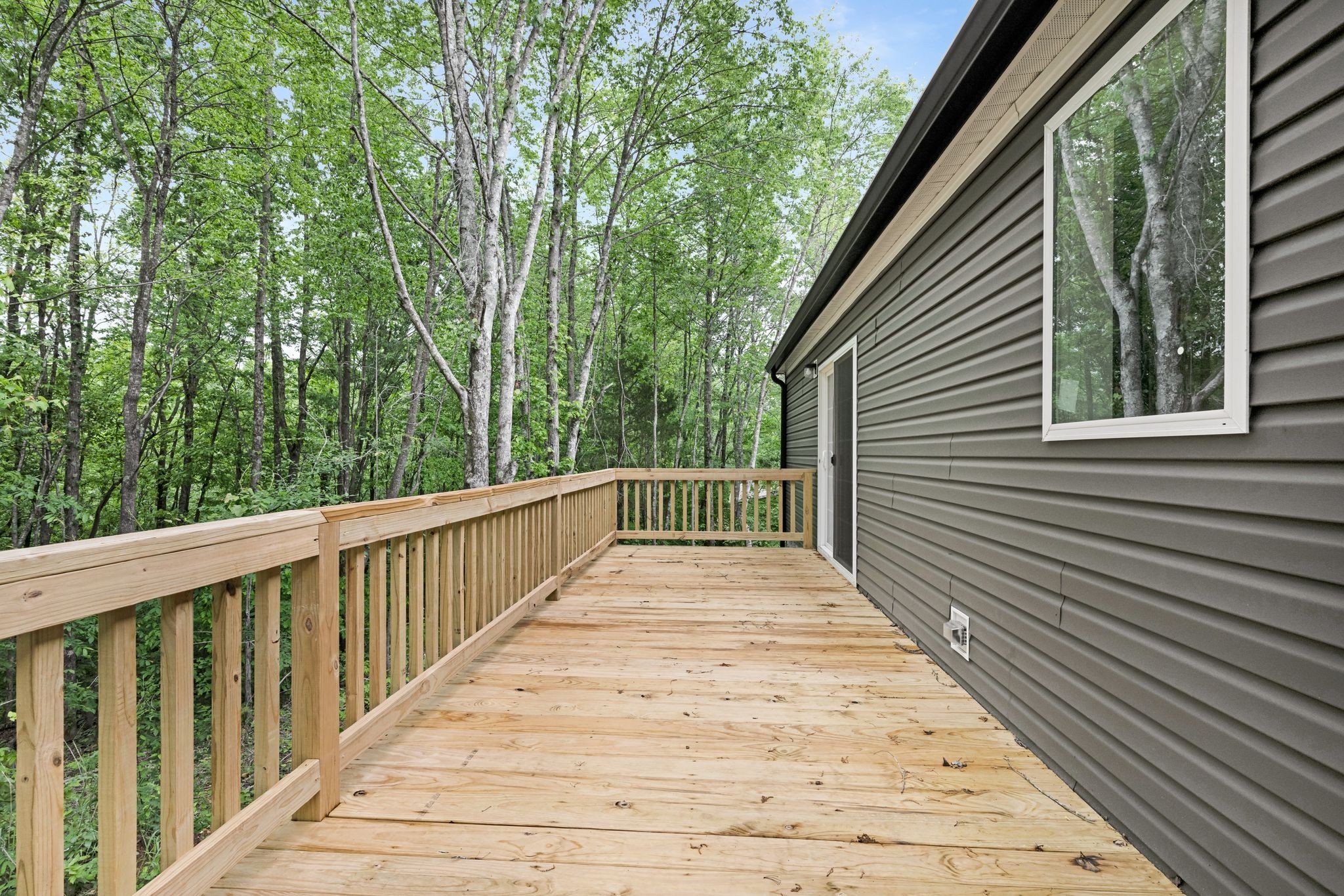 270 East Little Richland Road Waverly, TN 37185 - Photo 35 of 35 a view of a wooden balcony and trees