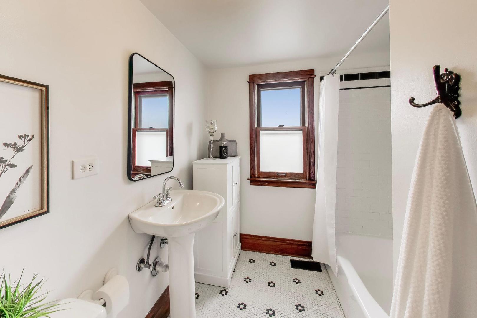 256 Blackhawk Road Riverside, IL 60546 - Photo 35 of 73 a bathroom with a sink a toilet and shower