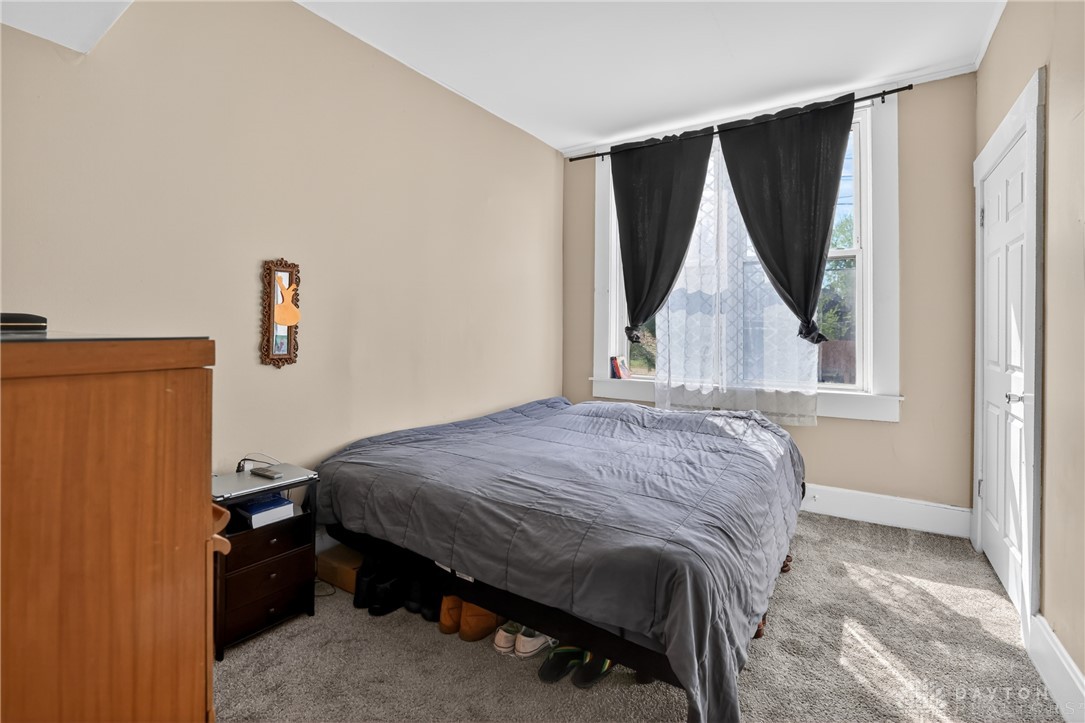 7045-7049 Montgomery Road Cincinnati, OH 45236 - Photo 23 of 68 This cozy bedroom features ample natural light, perfect for restful nights and bright mornings.