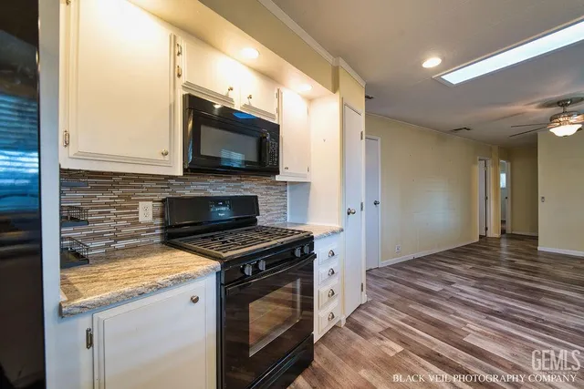 a kitchen with a stove and a microwave