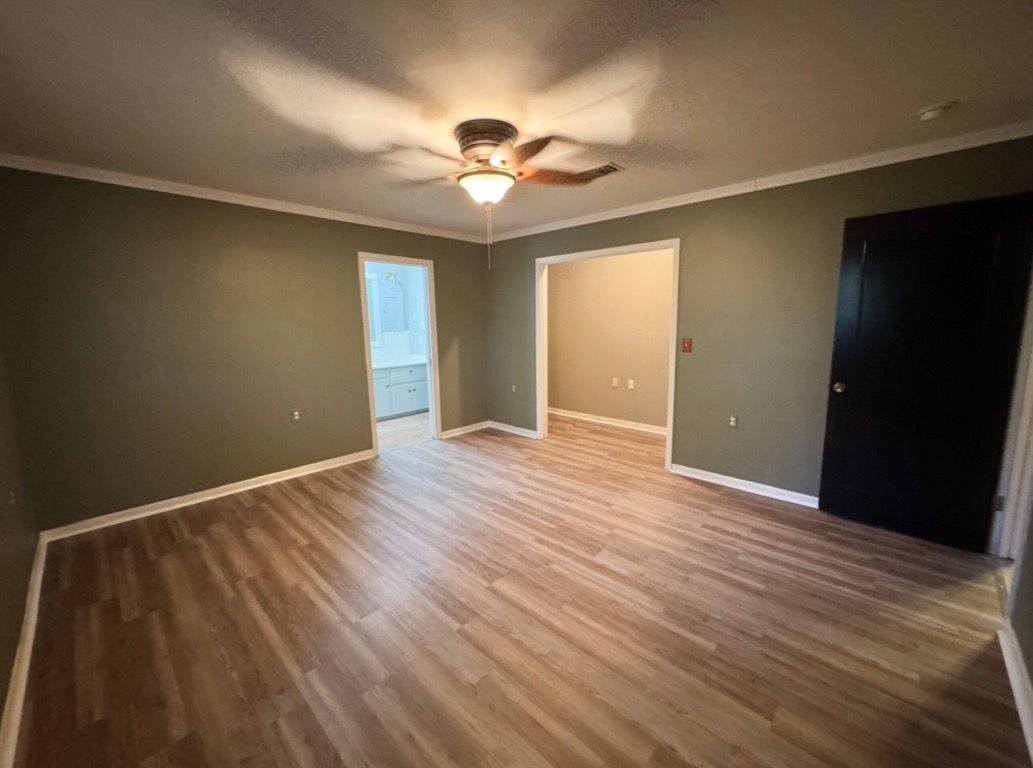 1225 Lake Terrace Drive Elgin, TX 78621 - Photo 15 of 28 a view of an empty room with wooden floor