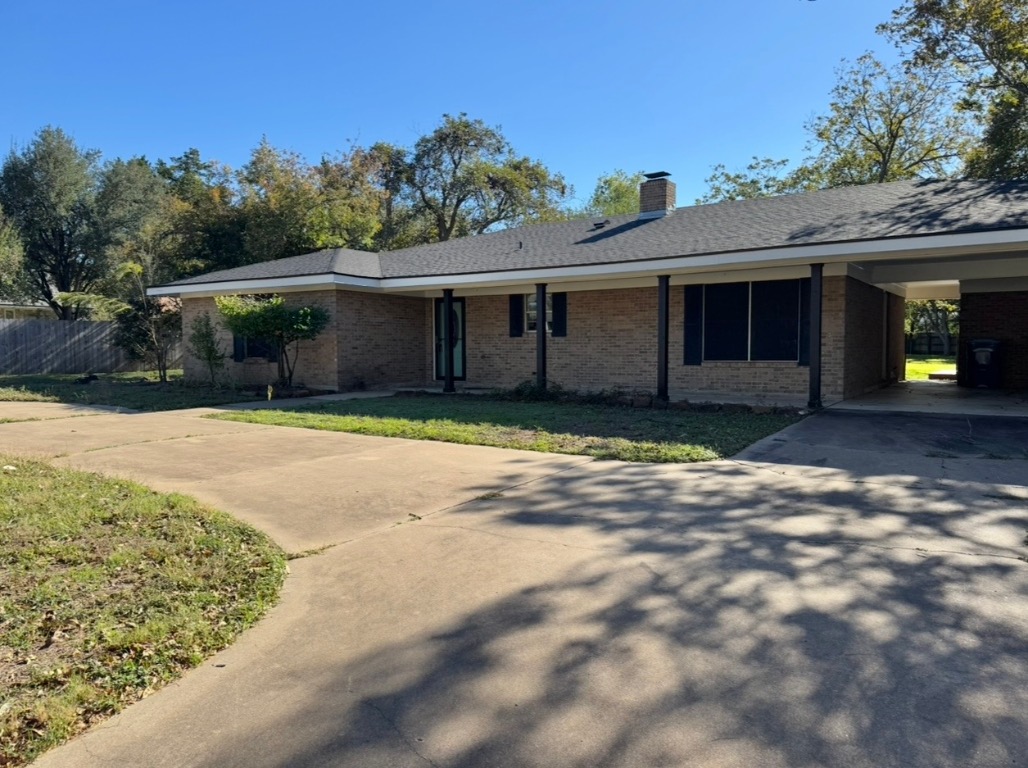 1225 Lake Terrace Drive Elgin, TX 78621 - Photo 2 of 28 a front view of a house with a yard