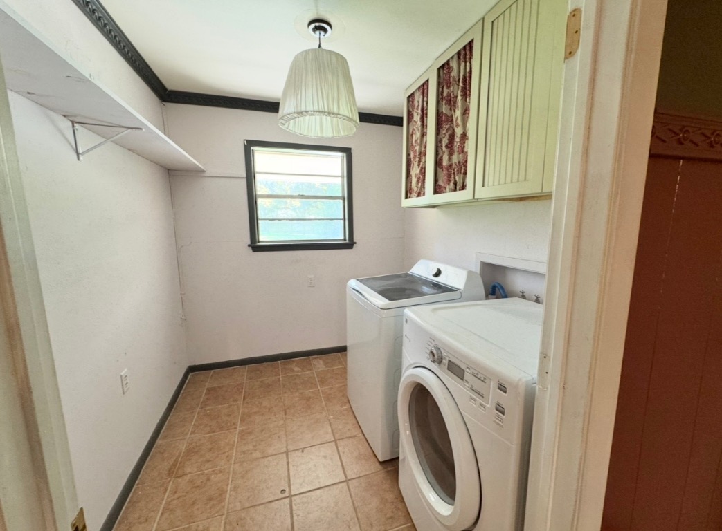 1225 Lake Terrace Drive Elgin, TX 78621 - Photo 23 of 28 a view of storage and utility room with washer and dryer