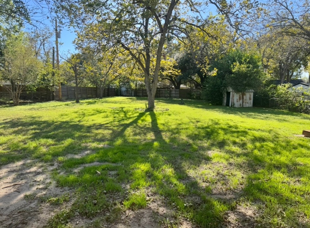 1225 Lake Terrace Drive Elgin, TX 78621 - Photo 26 of 28 a view of a yard with trees