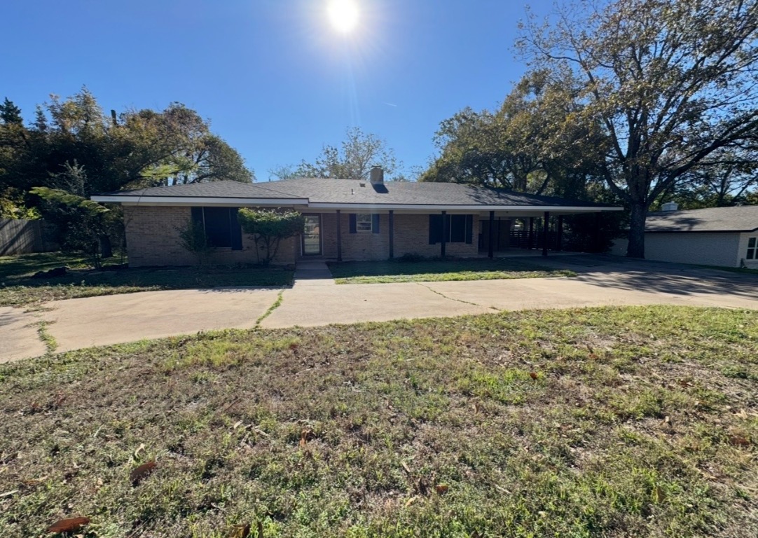 1225 Lake Terrace Drive Elgin, TX 78621 - Photo 4 of 28 a view of house with yard and trees in the background