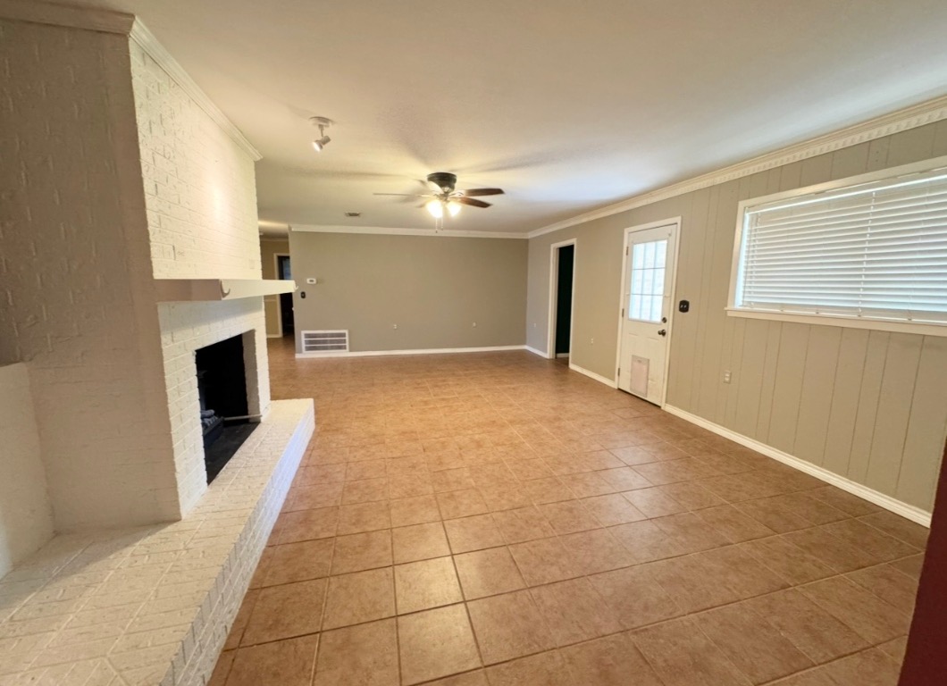 1225 Lake Terrace Drive Elgin, TX 78621 - Photo 7 of 28 a view of a livingroom with a fireplace a window and a fireplace