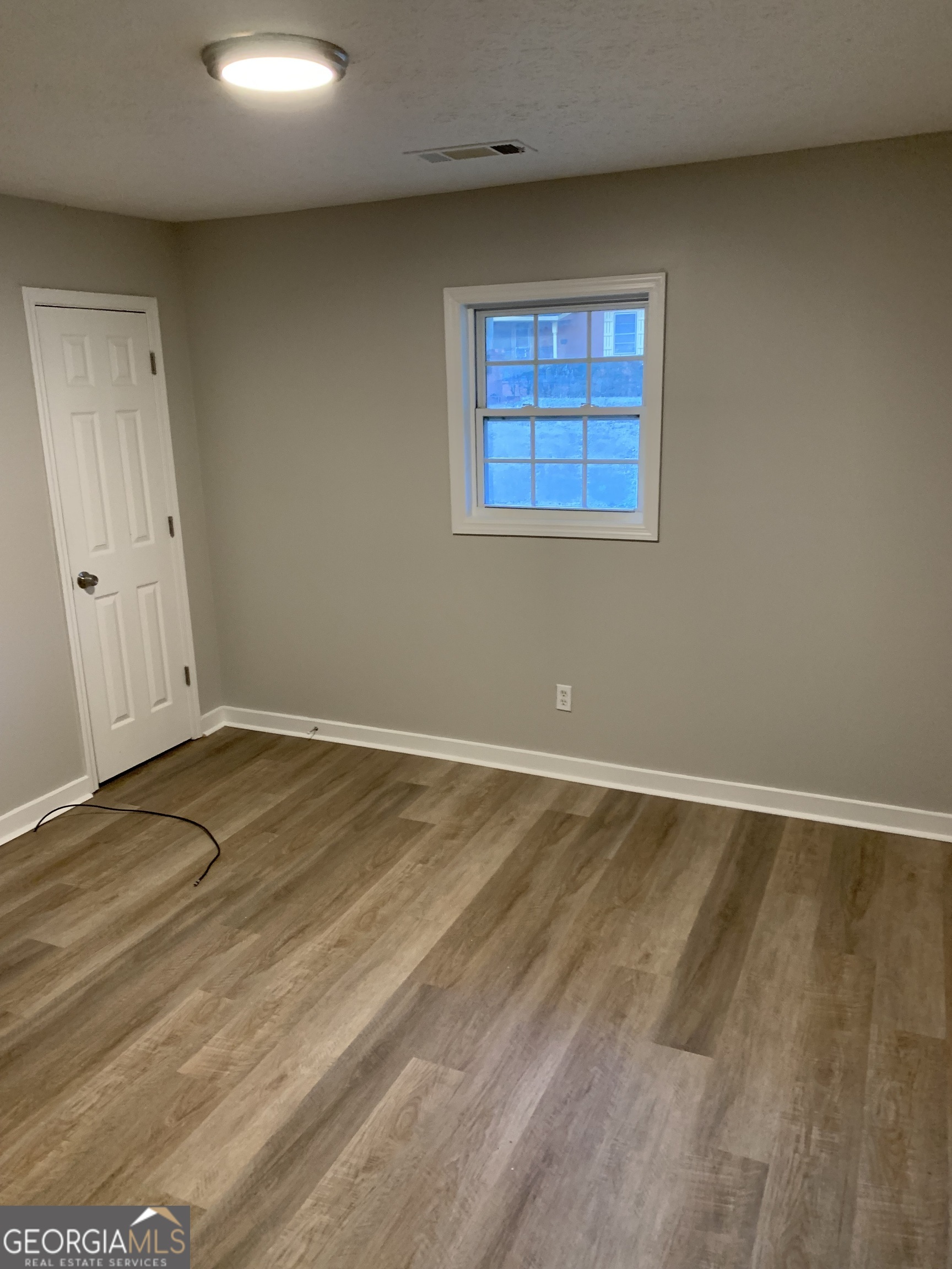 7181 Puckett Street Southwest Covington, GA 30014 - Photo 16 of 18 a view of an empty room