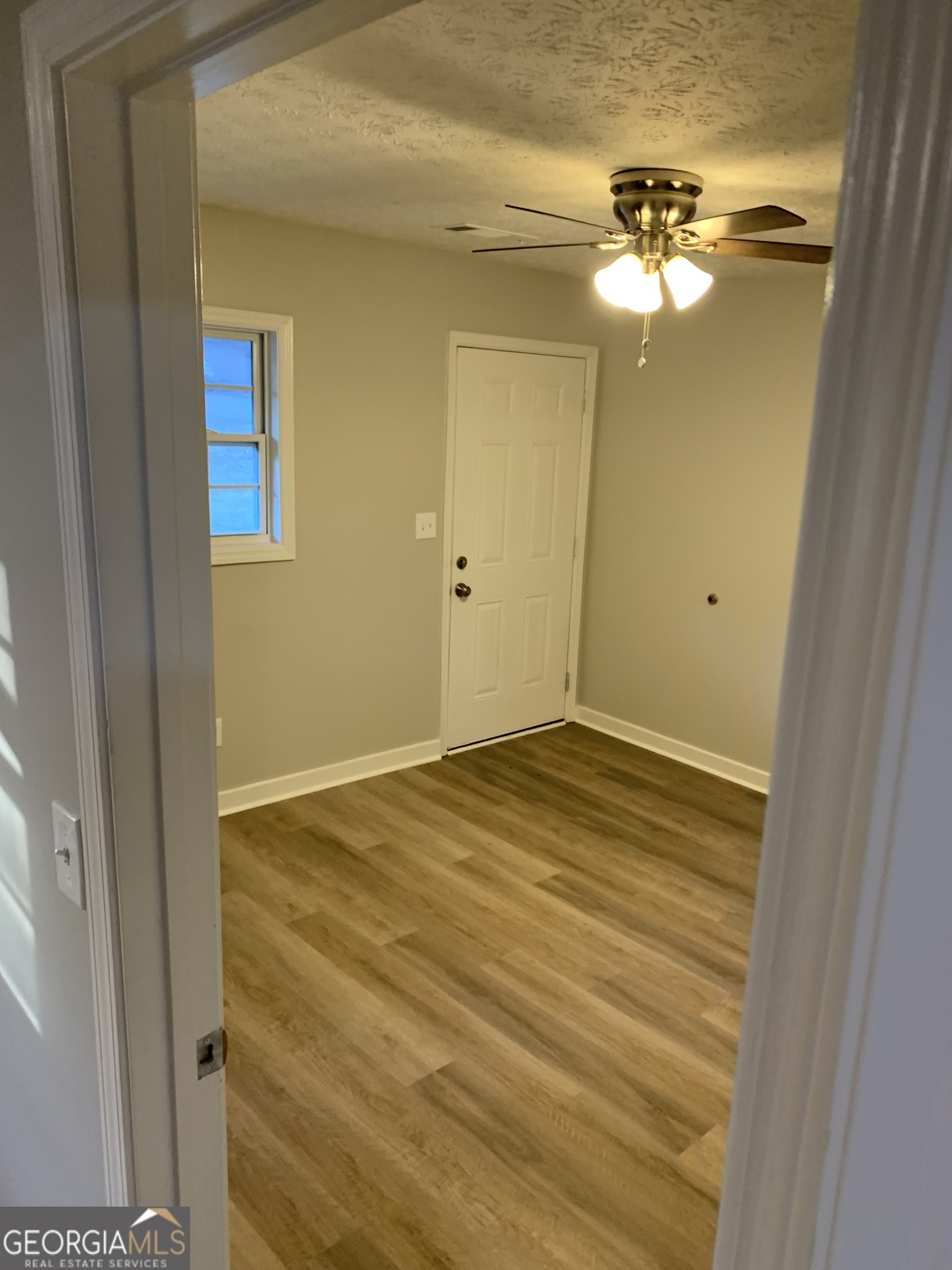 7181 Puckett Street Southwest Covington, GA 30014 - Photo 8 of 18 a view of empty room