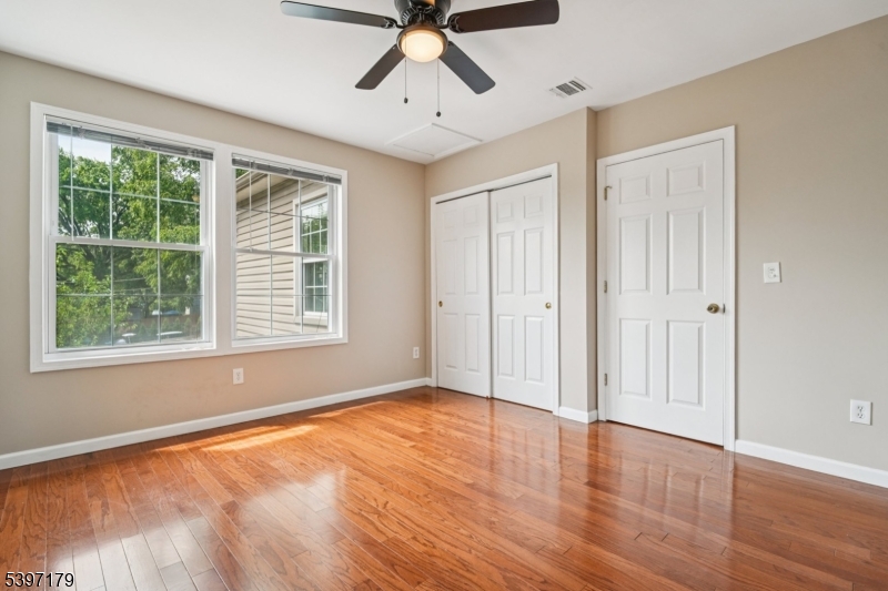 141 Walnut Street, Unit 2 Montclair, NJ 07042 - Photo 13 of 23 a view of empty room with wooden floor and fan