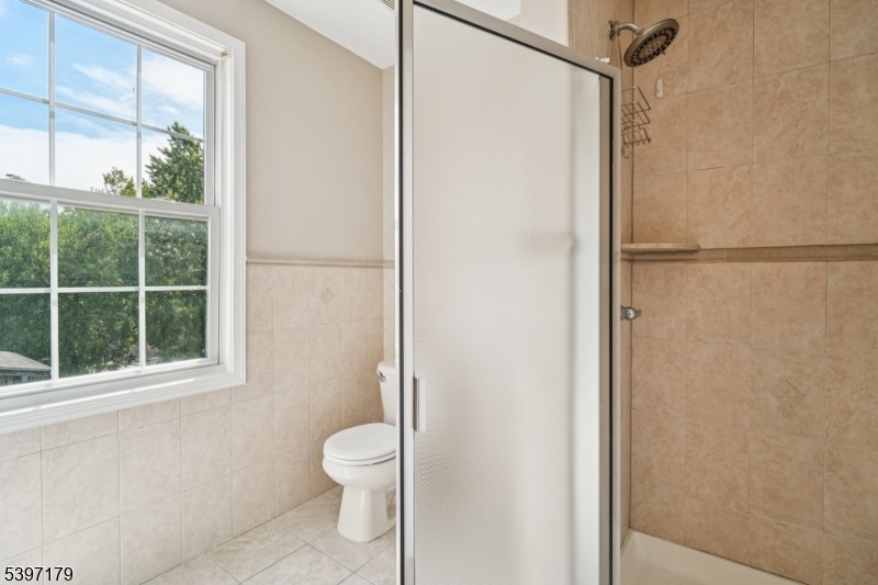 141 Walnut Street, Unit 2 Montclair, NJ 07042 - Photo 17 of 23 a bathroom with a toilet and a shower