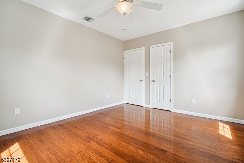 141 Walnut Street, Unit 2 Montclair, NJ 07042 - Photo 20 of 23 a view of an empty room with wooden floor