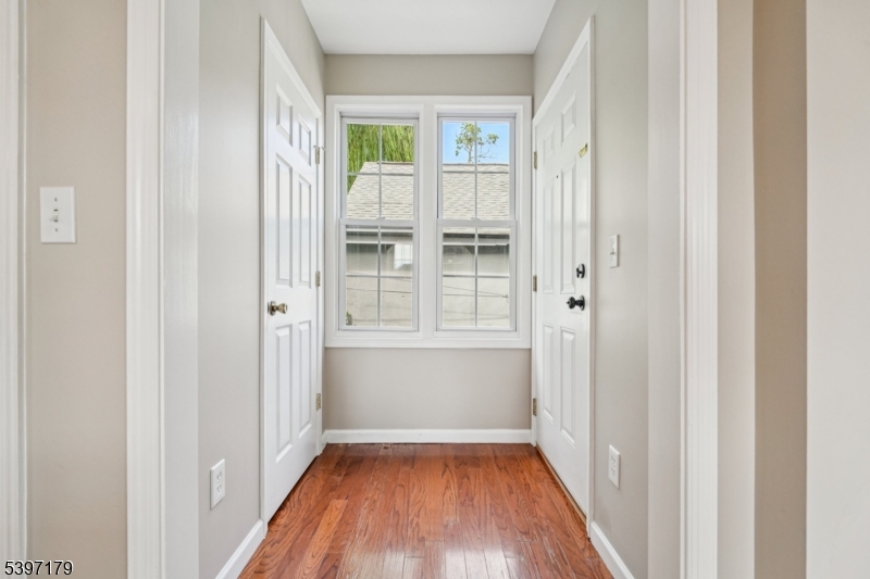 141 Walnut Street, Unit 2 Montclair, NJ 07042 - Photo 2 of 23 a view of a hallway with wooden floor and a window