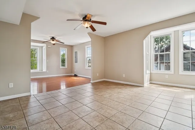 a view of an entryway with a chandelier fan