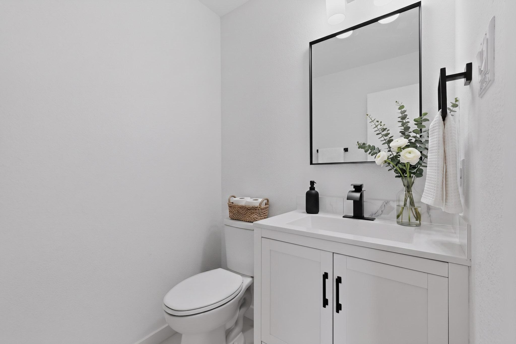 1200 Apollo Circle Round Rock, TX 78664 - Photo 20 of 45 a bathroom with a toilet sink and mirror
