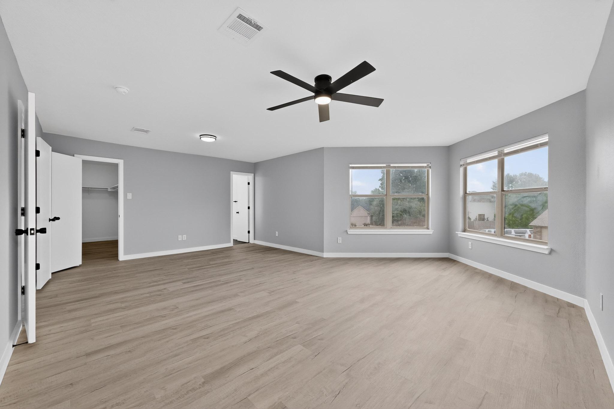 1200 Apollo Circle Round Rock, TX 78664 - Photo 27 of 45 a view of an empty room with a window and wooden floor