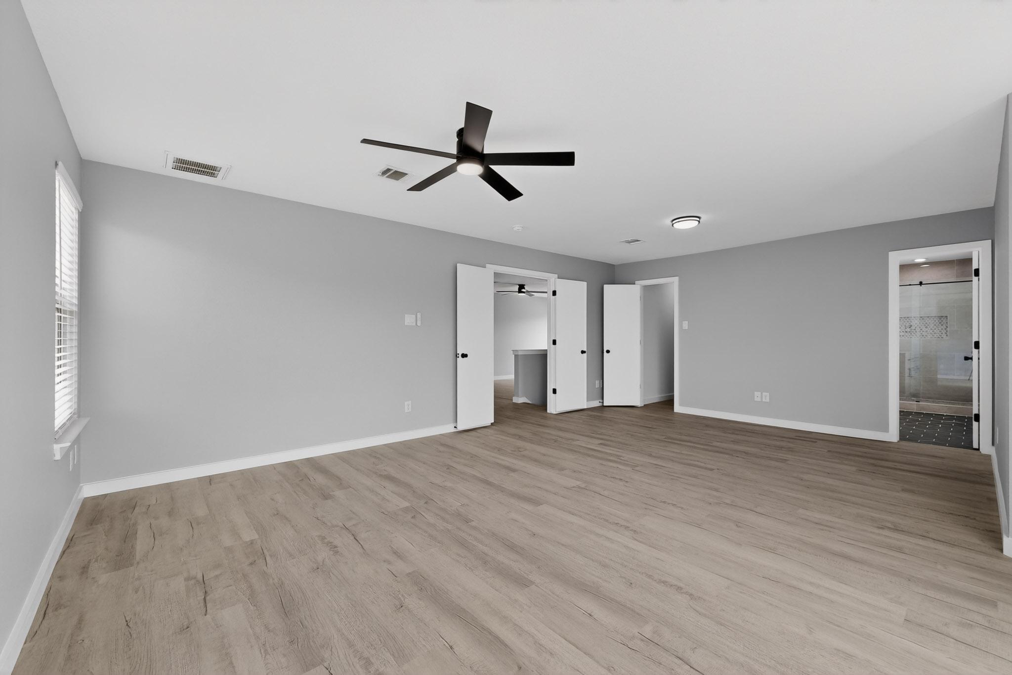 1200 Apollo Circle Round Rock, TX 78664 - Photo 28 of 45 a view of empty room with wooden floor and window