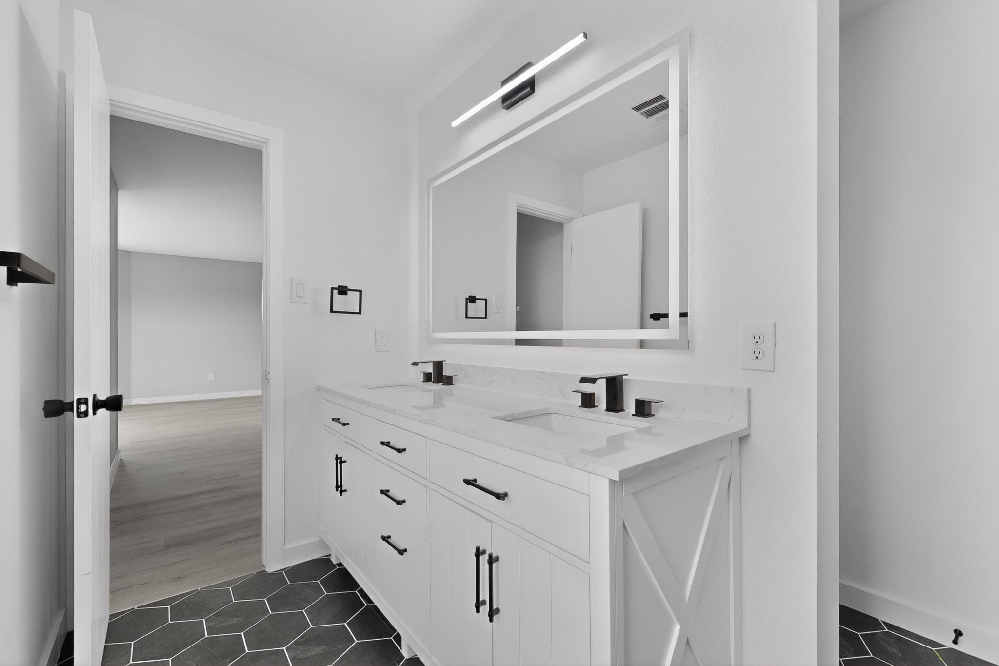 1200 Apollo Circle Round Rock, TX 78664 - Photo 29 of 45 a bathroom with a double vanity sink mirror and