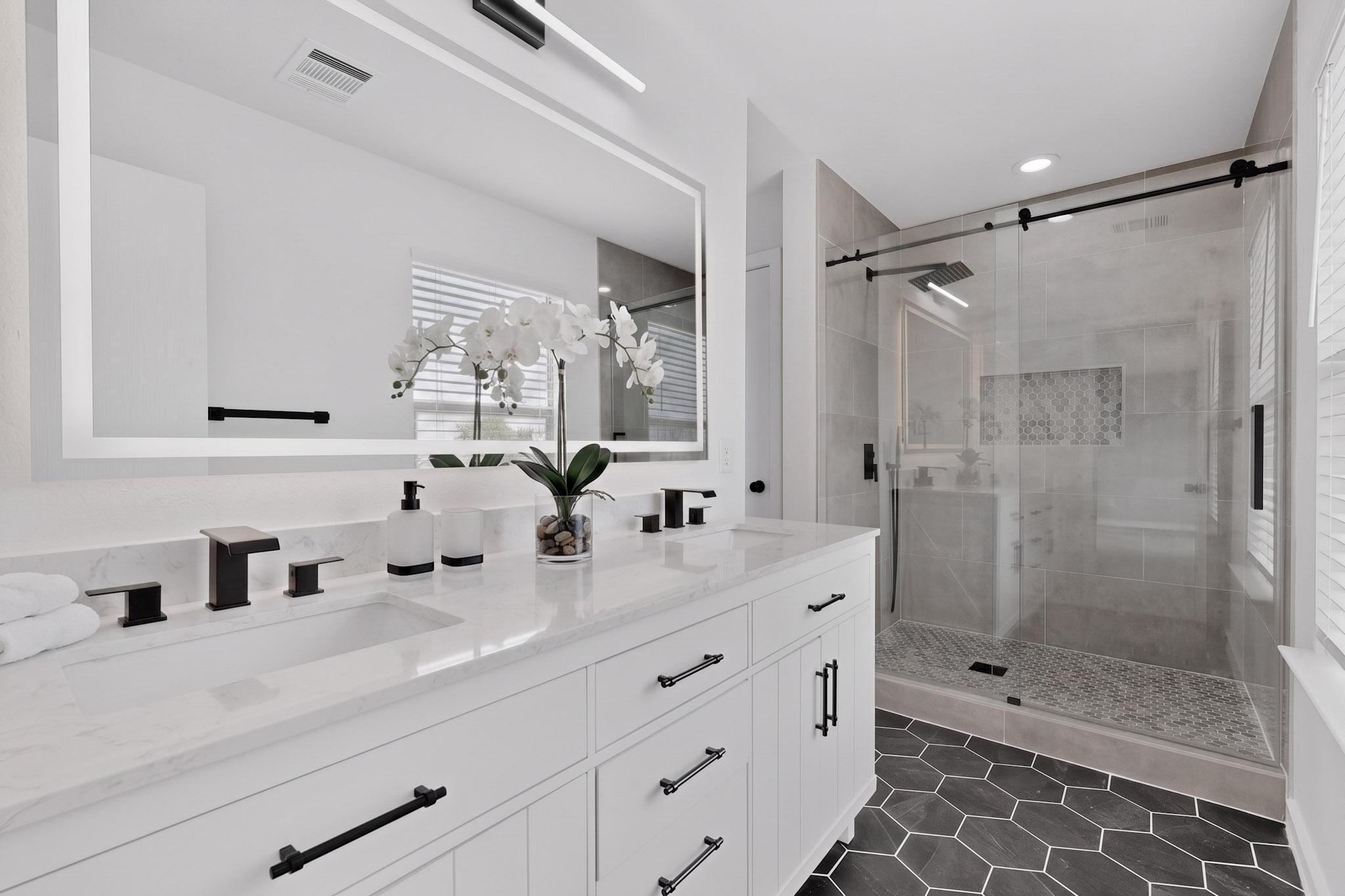 1200 Apollo Circle Round Rock, TX 78664 - Photo 30 of 45 a bathroom with a double vanity sink mirror and shower