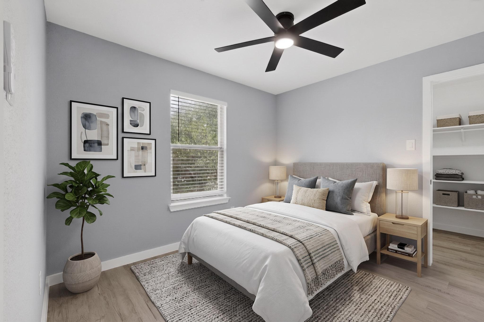 1200 Apollo Circle Round Rock, TX 78664 - Photo 33 of 45 a bedroom with a large bed and a potted plant