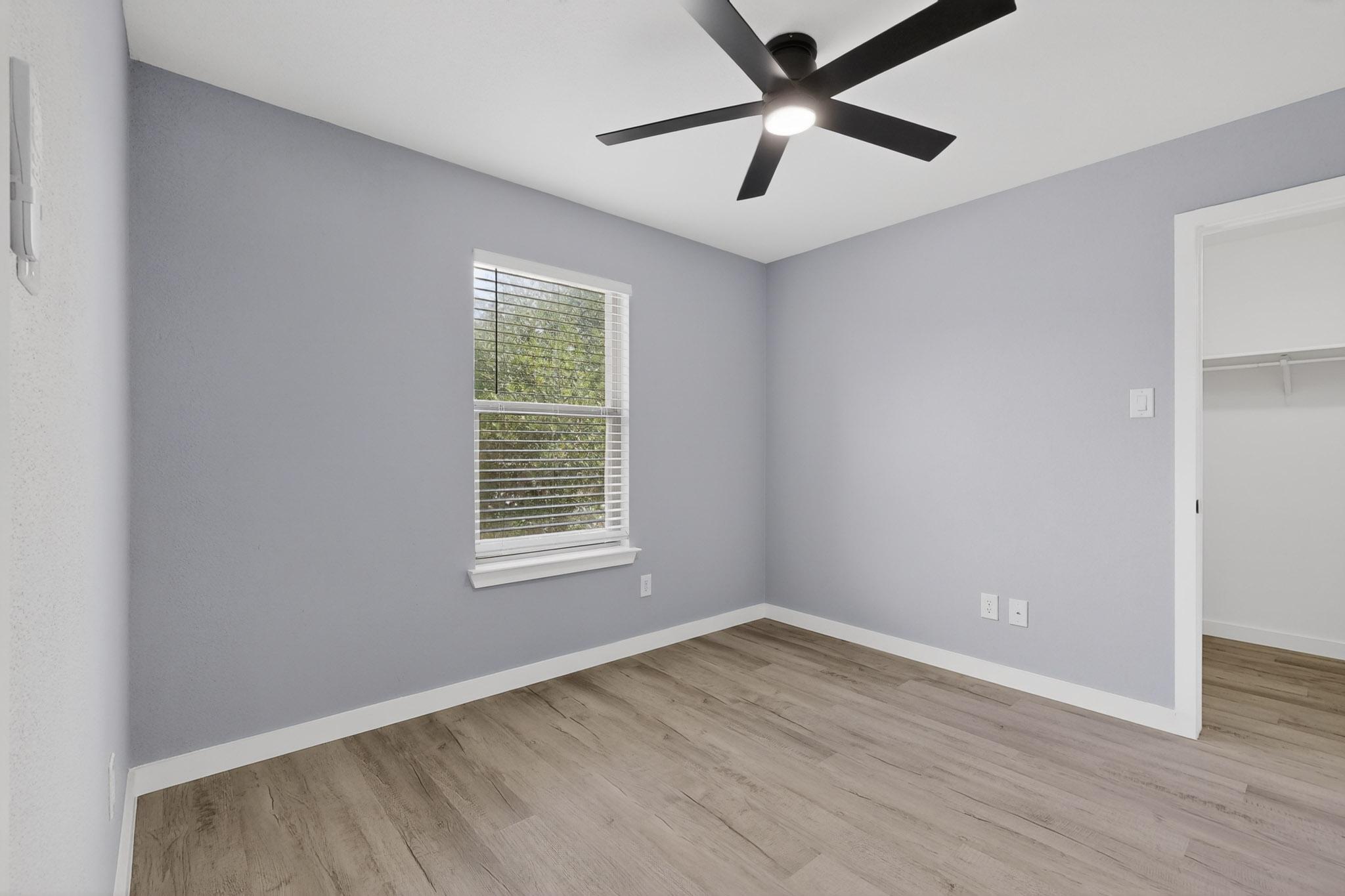 1200 Apollo Circle Round Rock, TX 78664 - Photo 34 of 45 an empty room with wooden floor and windows