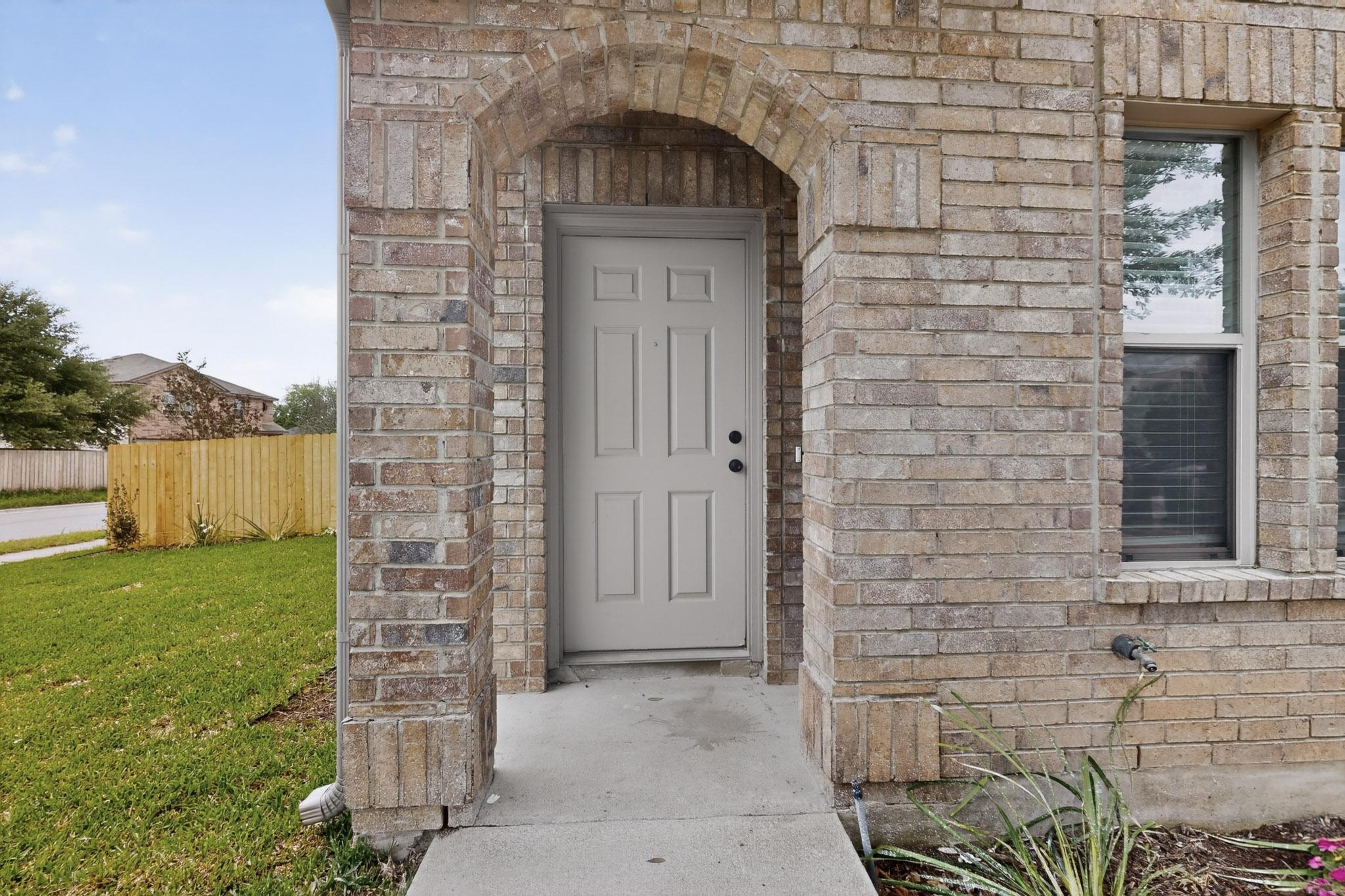 1200 Apollo Circle Round Rock, TX 78664 - Photo 4 of 45 a brick house with a yard