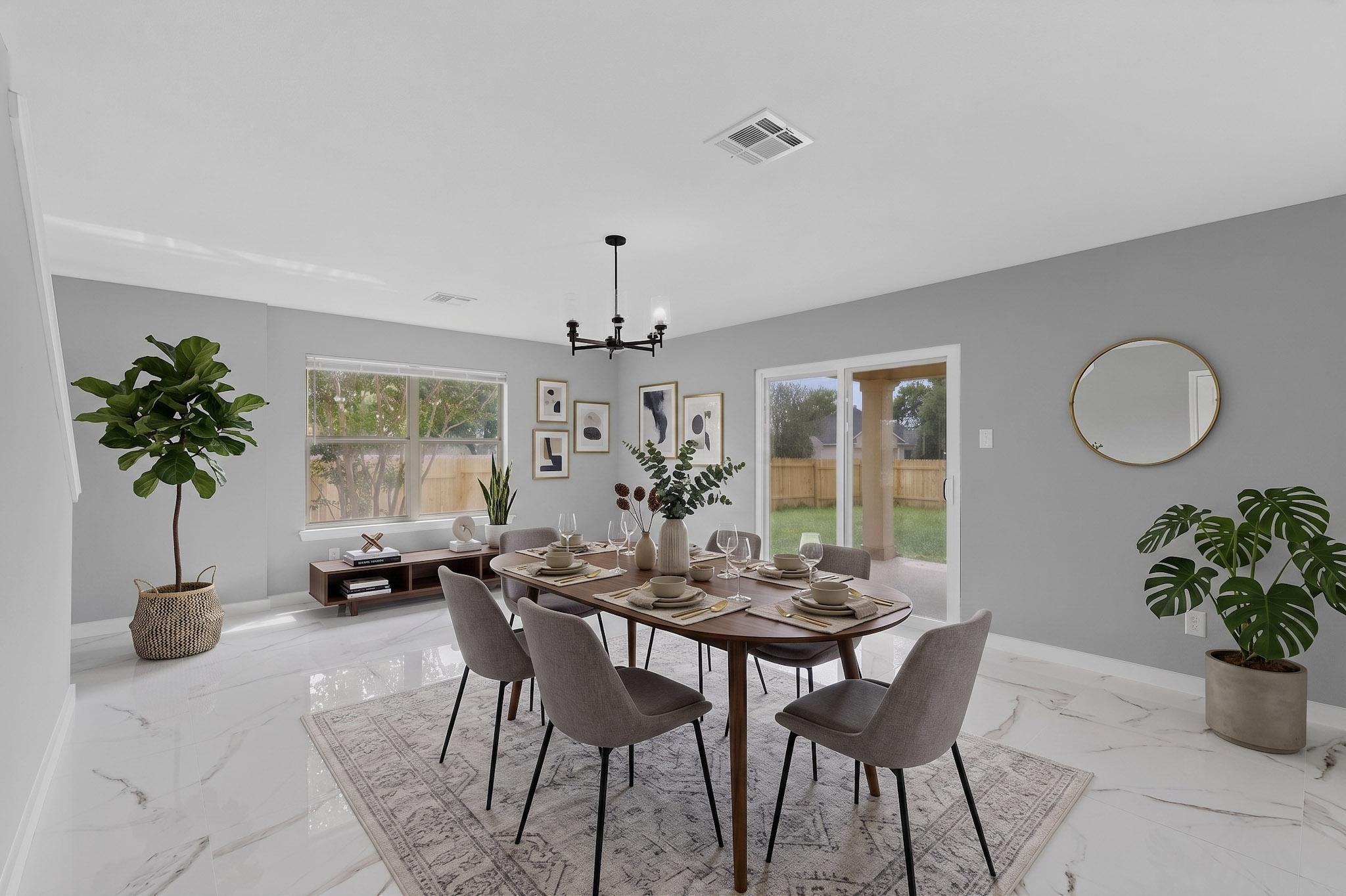 1200 Apollo Circle Round Rock, TX 78664 - Photo 9 of 45 a view of a dining room with furniture and potted plant