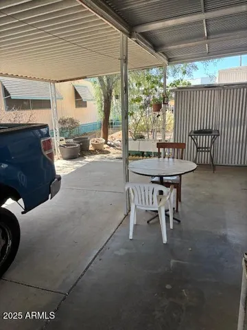 a dining room with furniture and a garden