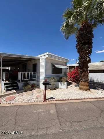 a view of a house with snow on the road