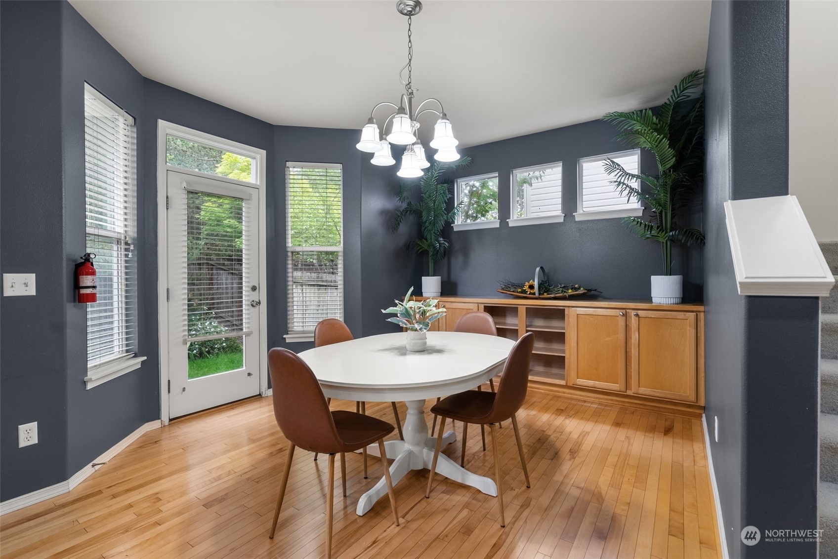 5049 Northeast 4th Place Renton, WA 98059 - Photo 15 of 39 a view of a dining room with furniture window and wooden floor